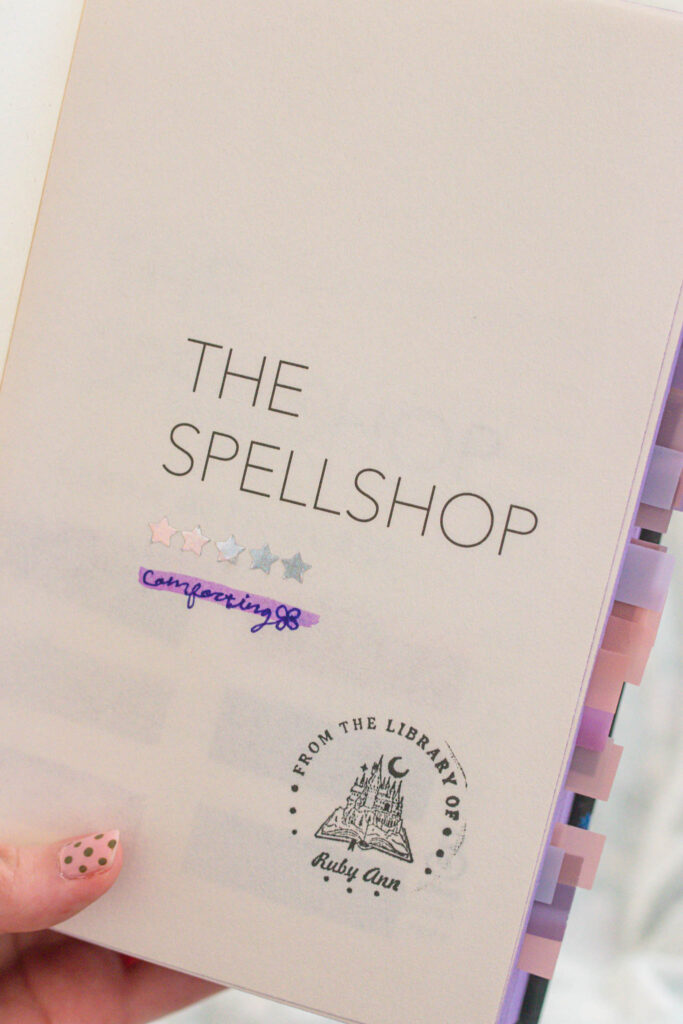 Inside page of a book marked with star stickers and handwritten notes, turning reading into a small, whimsical memory-keeping ritual.